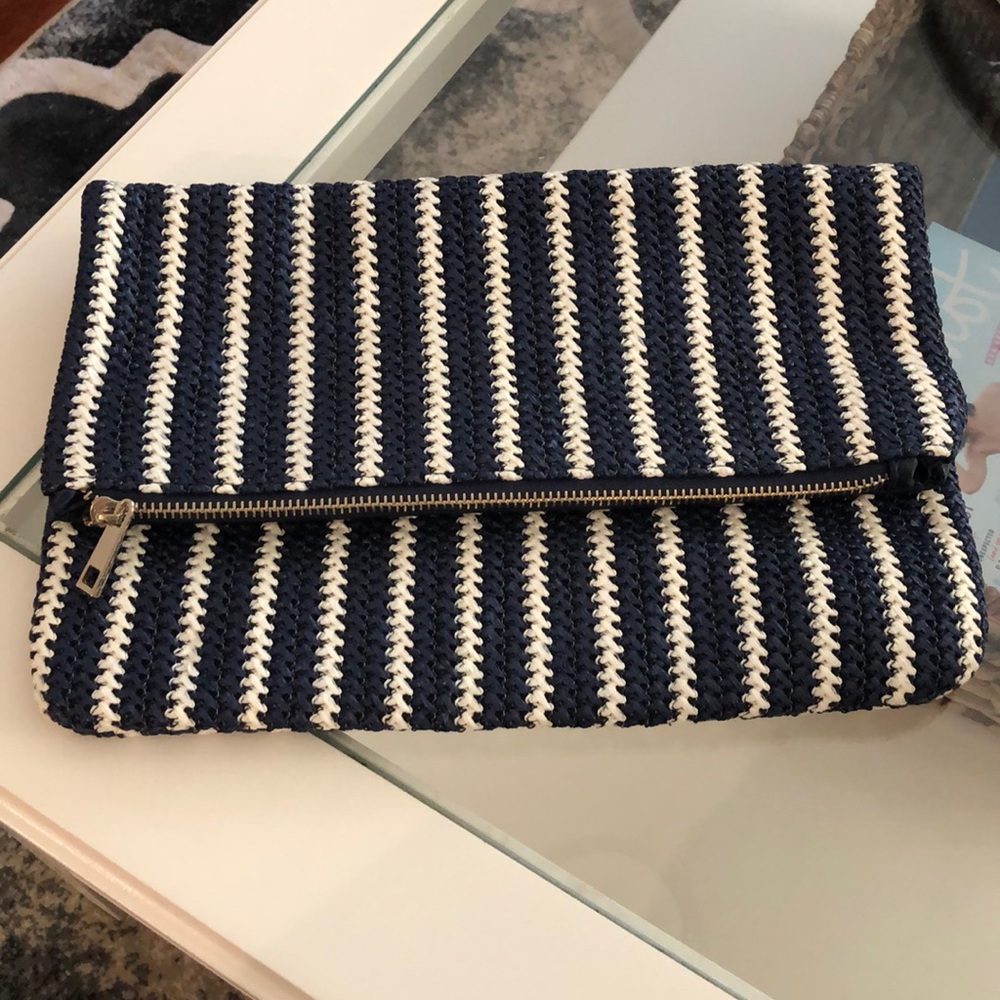 Woven navy and white clutch.